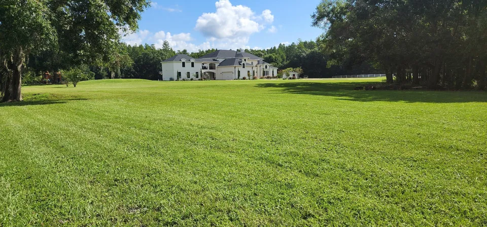 Weekly maintenance on a large estate lawn
